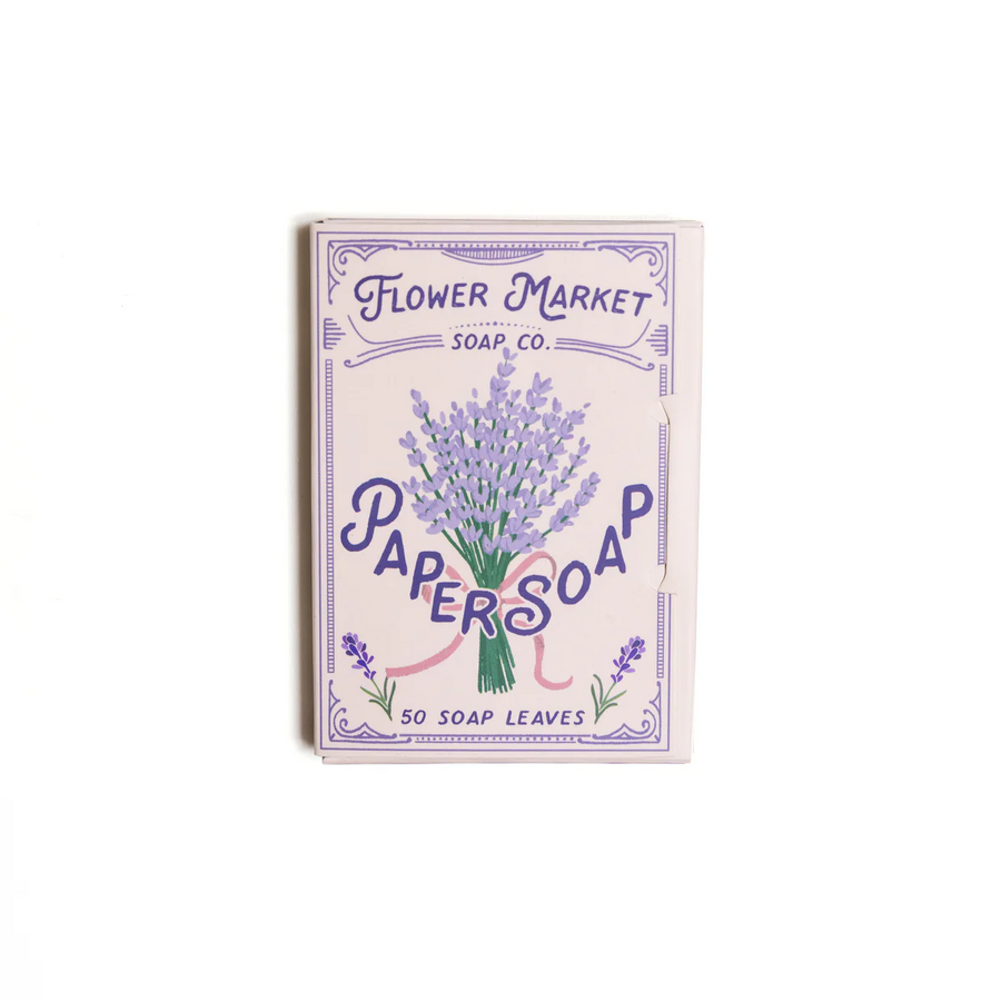 A package of 50 123 Farm Paper Soap leaves with a lavender design, with text indicating the product name and fragrance. 123Farm is available at Luca Essentials in Los Angeles.