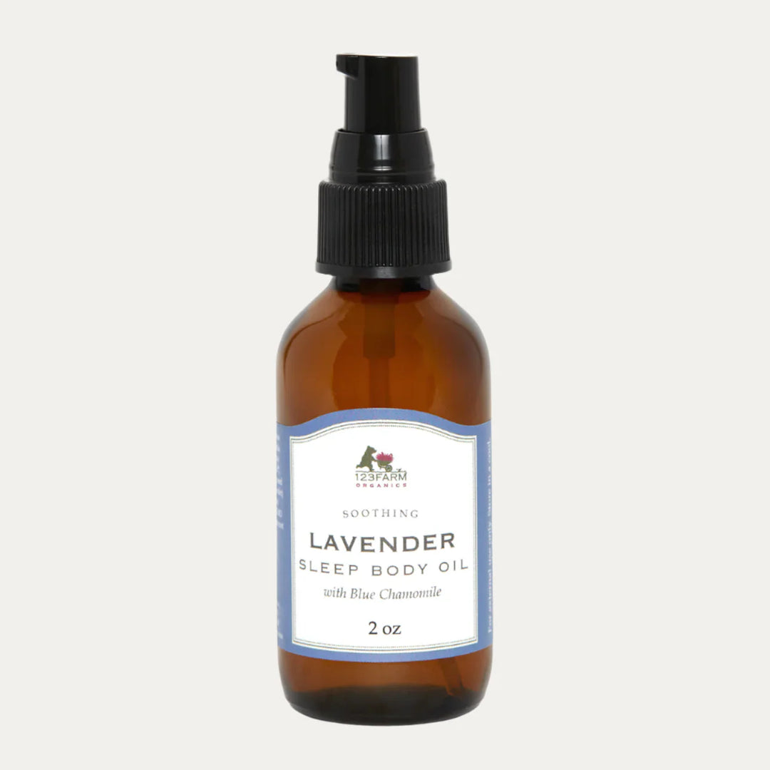 Amber glass bottle of 123 Farm Lavender Sleep Body Oil on a white background. 123 Farm is available at Luca Essentials in Los Angeles.