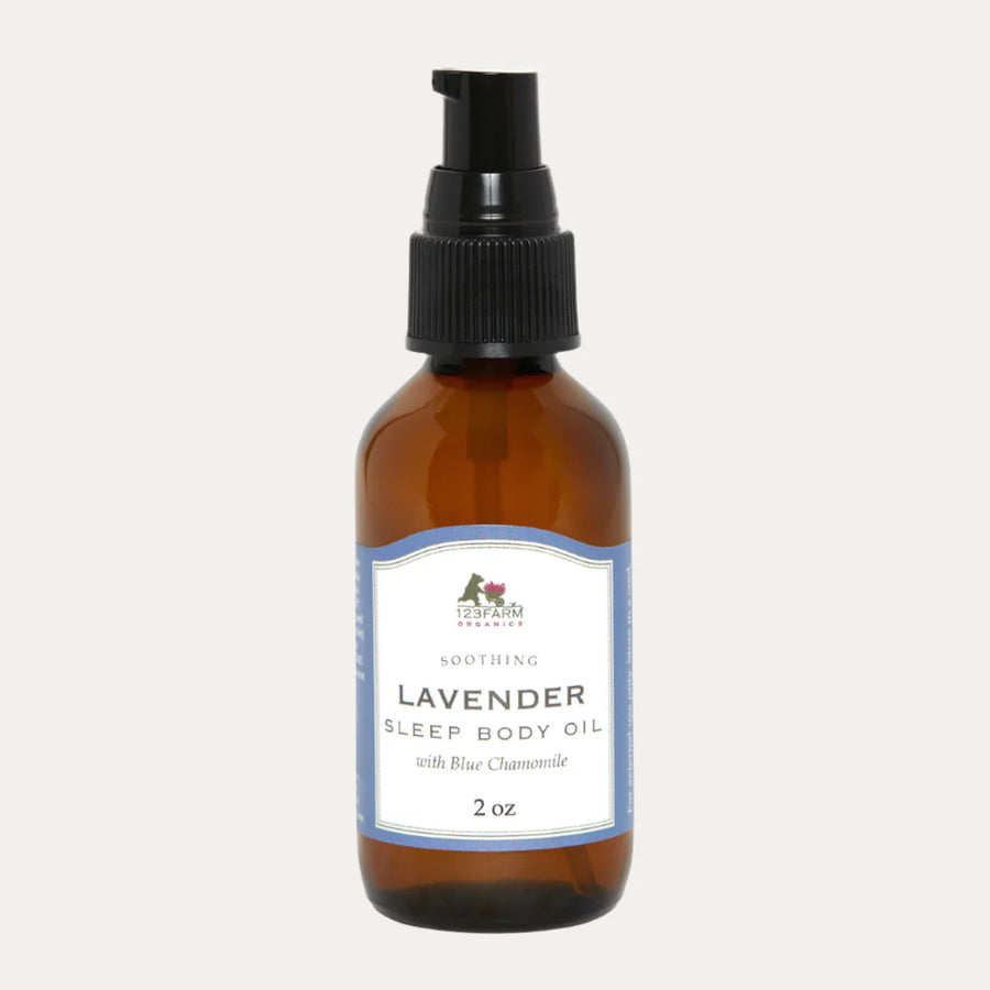 Amber glass bottle of 123 Farm Lavender Sleep Body Oil on a white background. 123 Farm is available at Luca Essentials in Los Angeles.