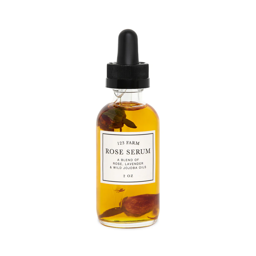 Glass dropper bottle of 123 Farm Rose Serum, a blend of rose, lavender, and wild jojoba oils. Available at Luca Essentials in Los Angeles.