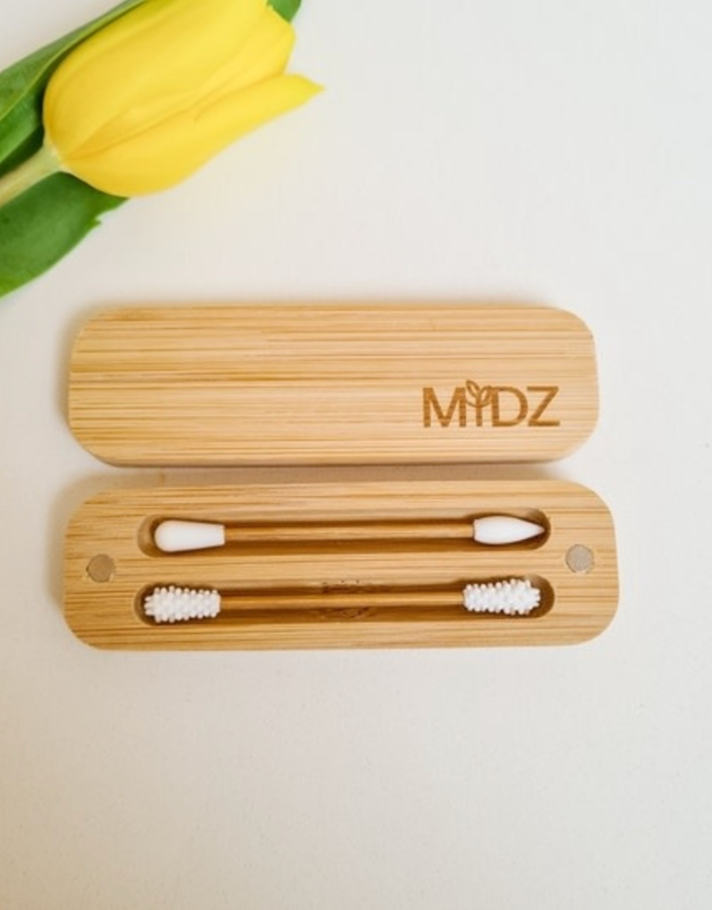 A pair of bamboo silicone swabs with different ends for makeup application and ear cleaning, displayed in an open bamboo case with a magnetic closure. Bamboo Switch is available at Luca Essentials in Los Angeles.