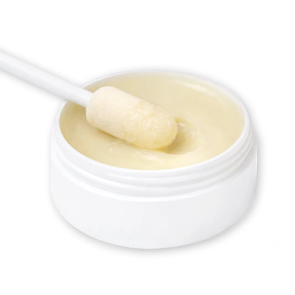 Close-up of Pure & Natural Pet Certified Organic Boo Boo Balm to show texture with a foam tip. Available at Luca Essentials in Los Angeles.