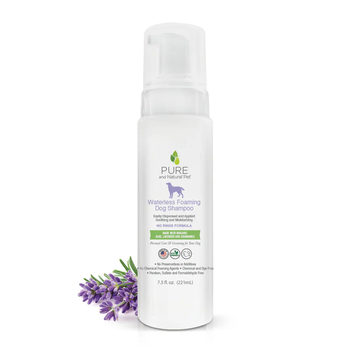 White bottle of Pure and Natural Pet Waterless Foaming Dog Shampoo with lavender flowers on a white background. Available at Luca Essentials in Los Angeles.