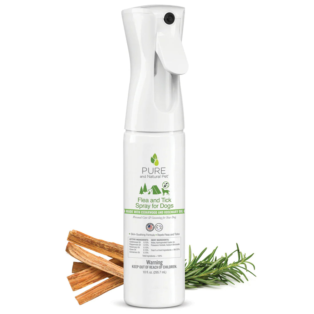Spray bottle of Pure and Natural Pet Flea and Tick Spray for Dogs on a white background with cinnamon sticks and rosemary. Available at Luca Essentials in Los Angeles.