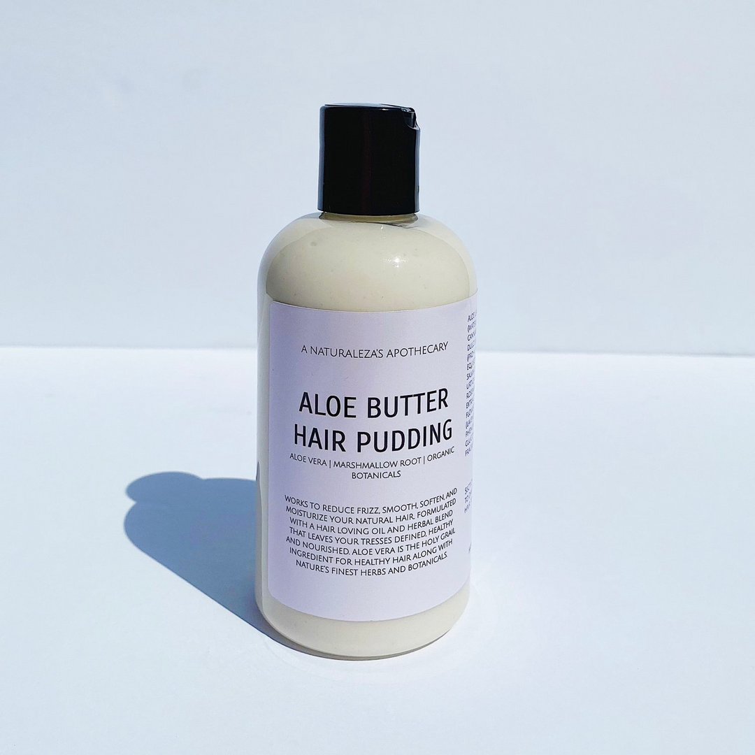 Bottle of cream colored aloe butter hair pudding on a white background. Available at Luca Essentials in Los Angeles.