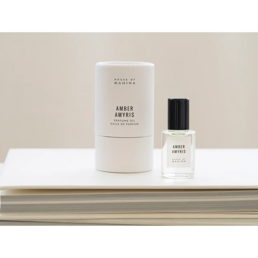 Two bottles of 'Amber Amyris' perfume on a light surface with a neutral background

Hand-blended in micro batches, our perfume oil is composed of organic fractionated coconut oil and our blend of premium phthalate-free fragrance/essential oils. 

Available at Luca Essentials in Los Angeles.