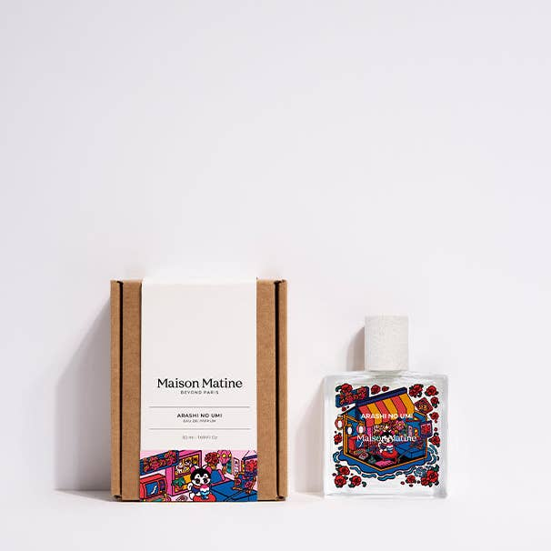 Glass bottle of Maison Matine perfume with colorful illustration of a lucky cat figure in a cafe on a white background. 

Maison Matine perfumes each have their own refreshing scent. The unisex, fresh, unique fragrances are created by eclectic, talented, creative perfumers.

Available at Luca Essentials in Los Angeles. 