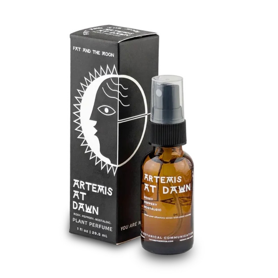 Black packaging and an amber bottle with the name 'Artemis at Dawn' on a white background. Available at Luca Essentials in Los Angeles. 