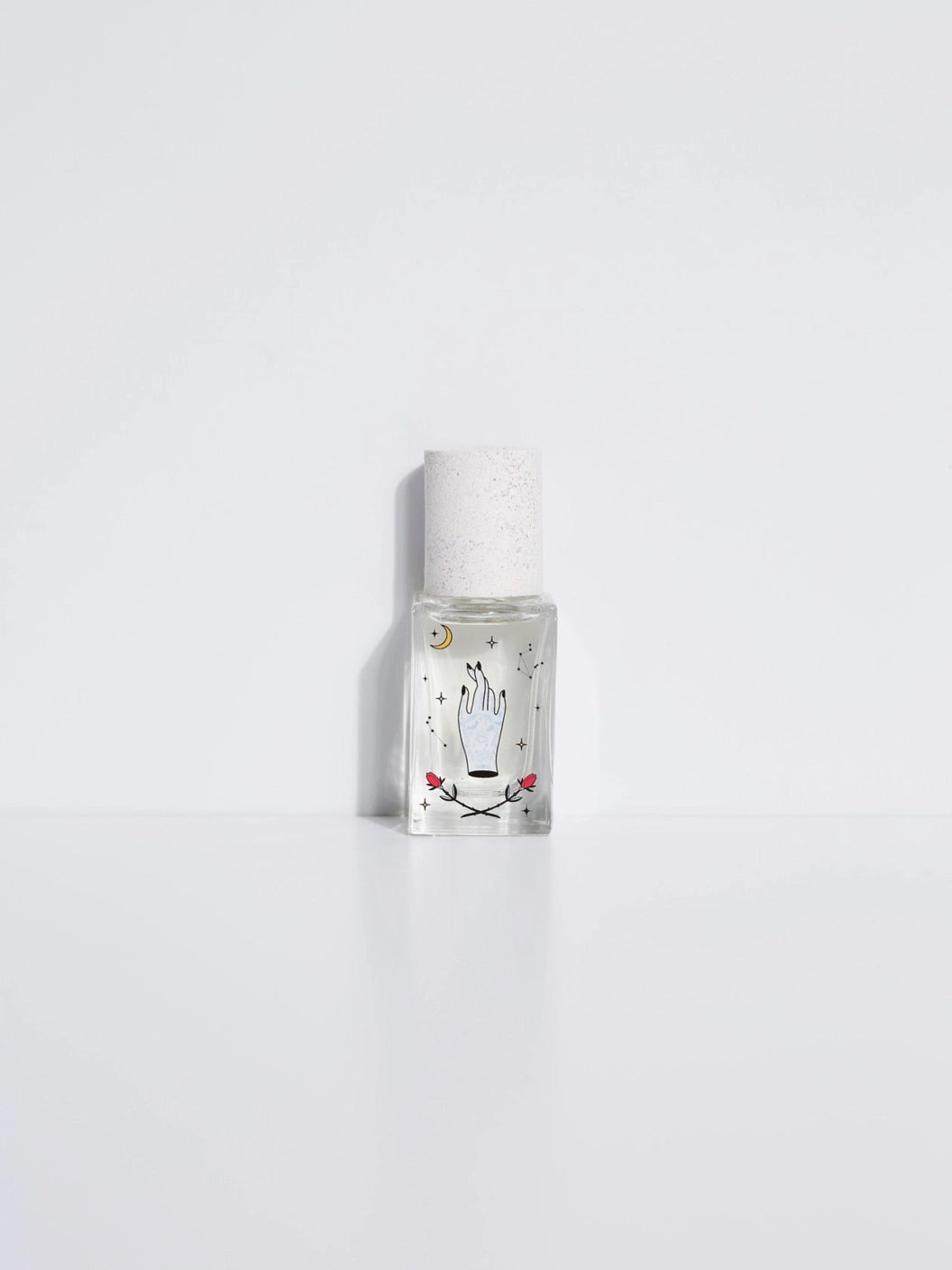A small, clear bottle of Maison Matine perfume with a white label depicting a hand with a moon, stars and rose with cap, presented against a white background.

Maison Matine perfumes each have their own refreshing scent. The unisex, fresh, unique fragrances are created by eclectic, talented, creative perfumers.

Available at Luca Essentials in Los Angeles. 