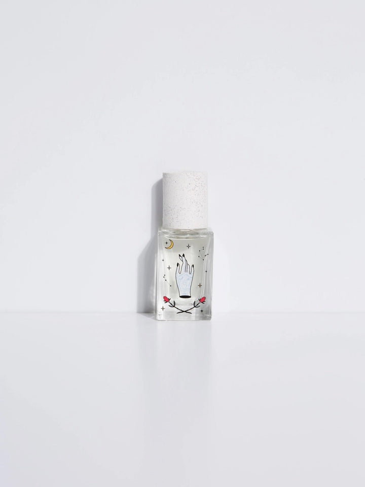 A small, clear bottle of Maison Matine perfume with a white label depicting a hand with a moon, stars and rose with cap, presented against a white background.

Maison Matine perfumes each have their own refreshing scent. The unisex, fresh, unique fragrances are created by eclectic, talented, creative perfumers.

Available at Luca Essentials in Los Angeles. 