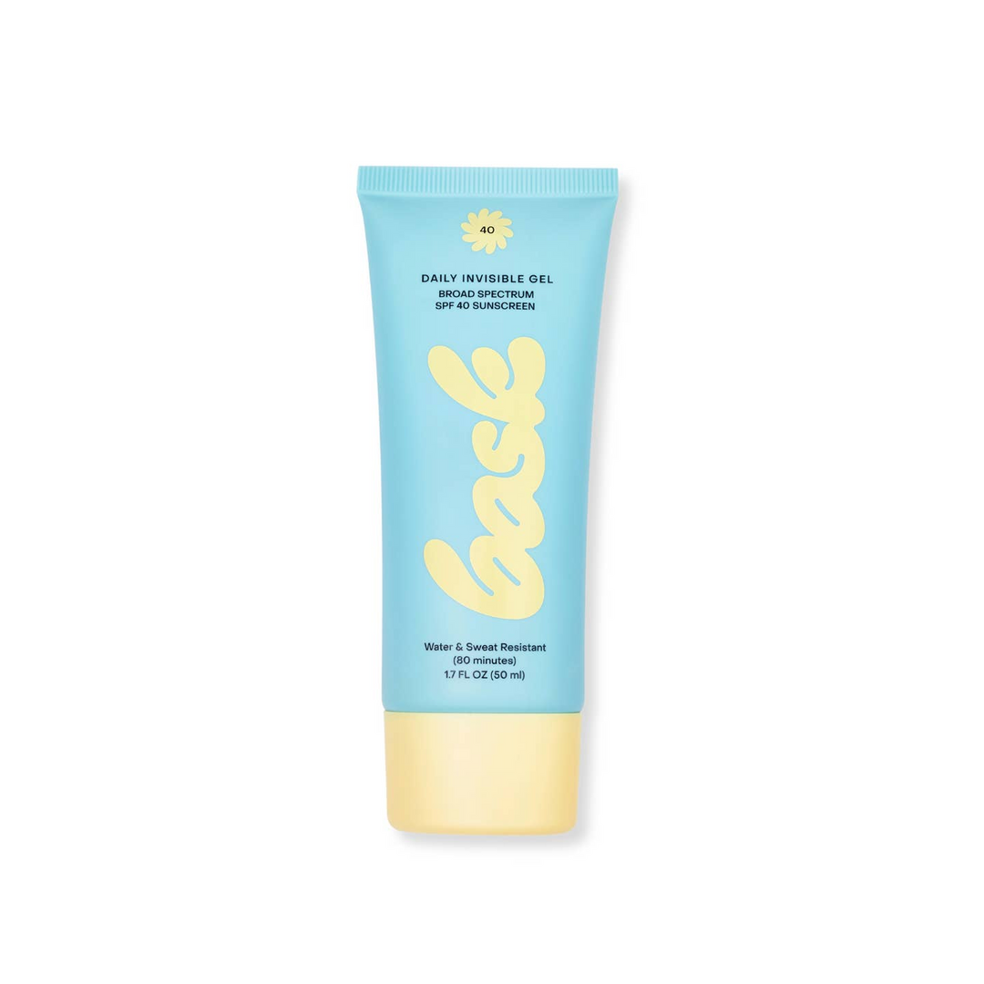 A tube of Bask Daily Invisible Gel Sunscreen with a blue body and a yellow cap. Bask is available at Luca Essentials in Los Angeles.