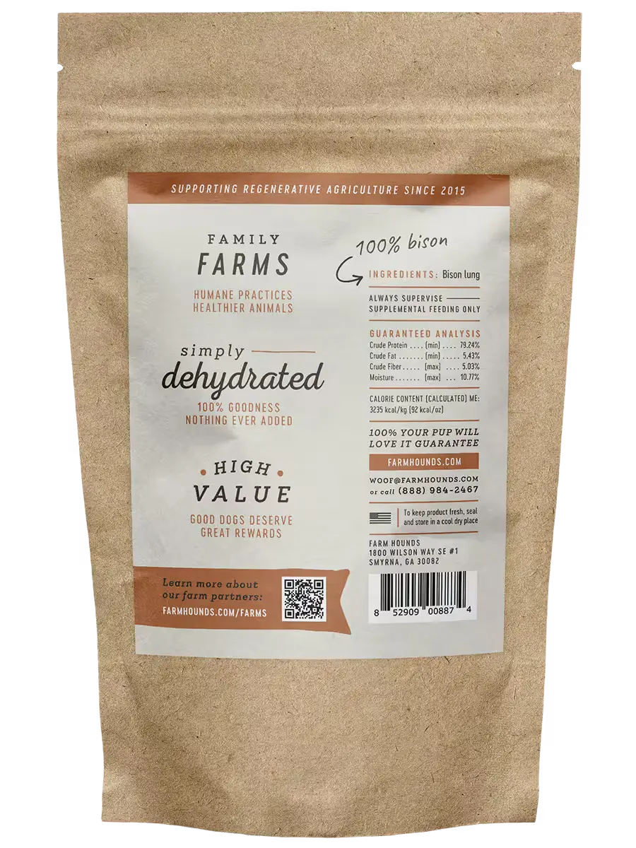 Kraft paper bag with a label for Family Farms dehydrated dog treats on a white background. Available at Luca Essentials in Los Angeles. 