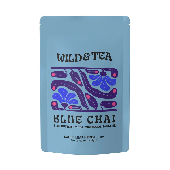 A light blue stand-up pouch of Wild & Tea Blue Chai loose leaf herbal tea, featuring a purple and blue floral pattern on the front. Available at Luca Essentials in Los Angeles. 