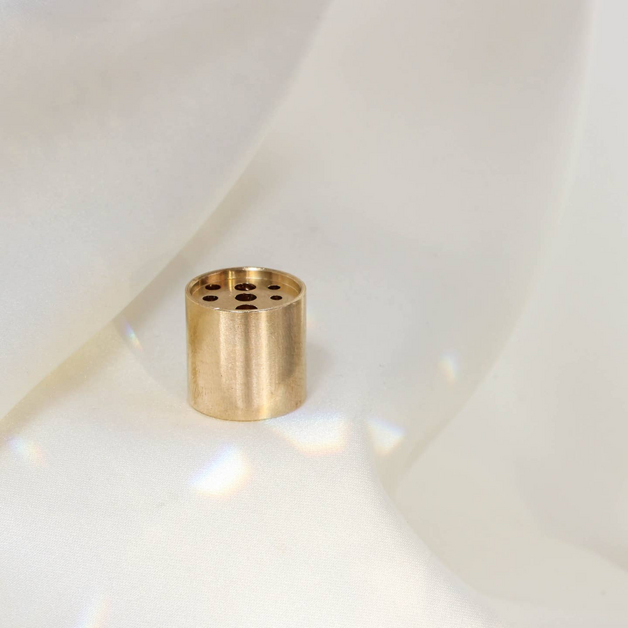 A gold-colored brass incense holder with multiple holes on its top surface, placed on a white fabric background.

Maison Matine perfumes each have their own refreshing scent. The unisex, fresh, unique fragrances are created by eclectic, talented, creative perfumers.

Available at Luca Essentials in Los Angeles. 