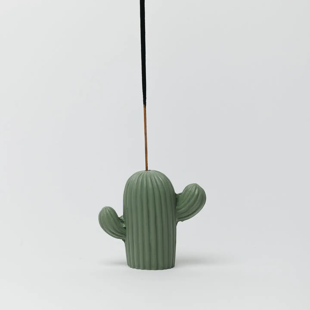 Cactus-shaped incense holder on a light gray background. Available at Luca Essentials in Los Angeles. 