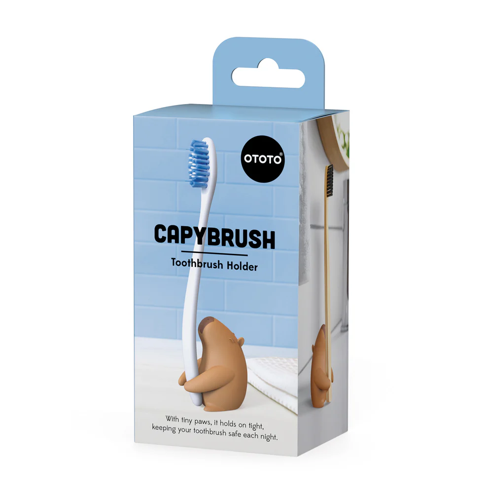 Capybrush toothbrush holder packaging with a blue background and 'Ototo' branding. Available at Luca Essentials in Los Angeles. 