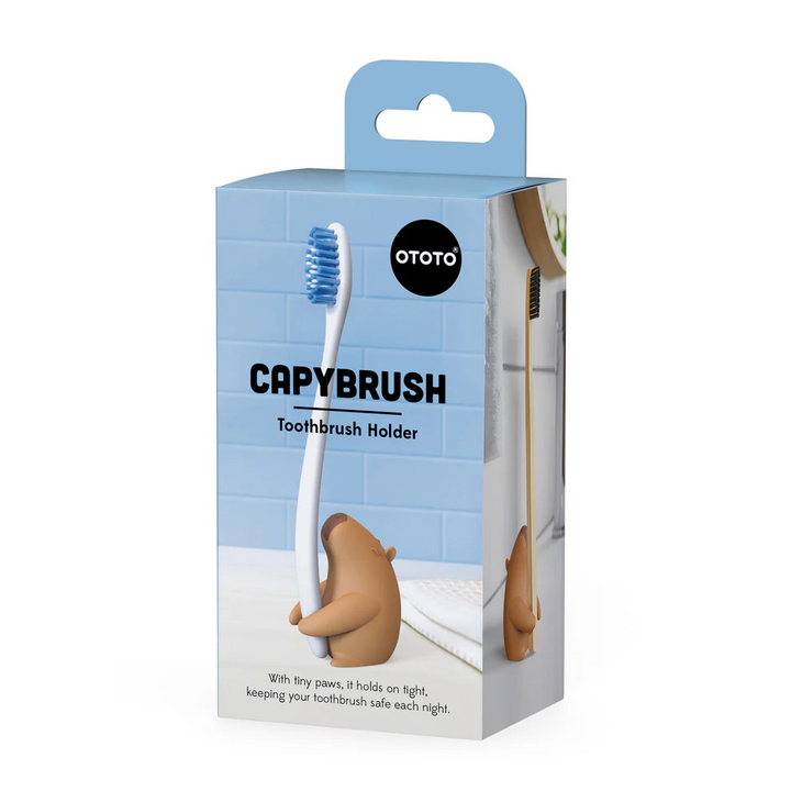 Capybrush toothbrush holder packaging with a blue background and 'Ototo' branding. Available at Luca Essentials in Los Angeles. 