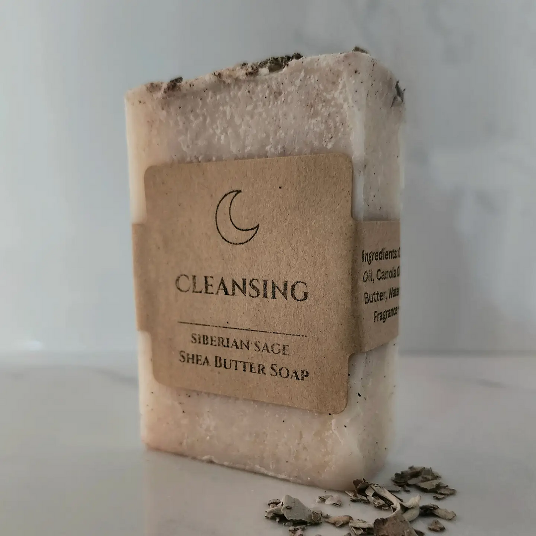 Bar of soap with a label with the name 'cleansing' on a neutral background. Available at Luca Essentials in Los Angeles. 
