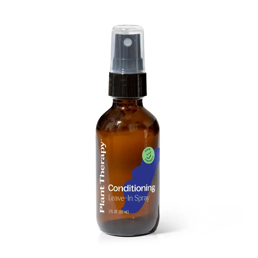 An amber glass spray bottle of Plant Therapy Conditioning Leave-In Spray with a clear cap and black spray nozzle, shown on a white background. Available at Luca Essentials in Los Angeles. 