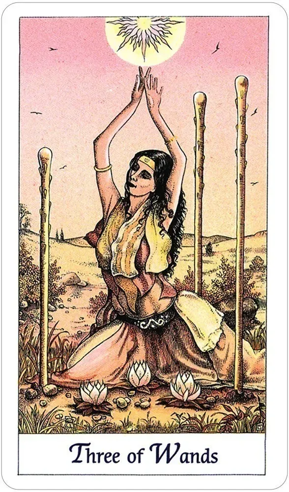 Tarot card titled 'Three of Wands' featuring a woman with her hands in the air against a pink sky. Available at Luca Essentials in Los Angeles. 