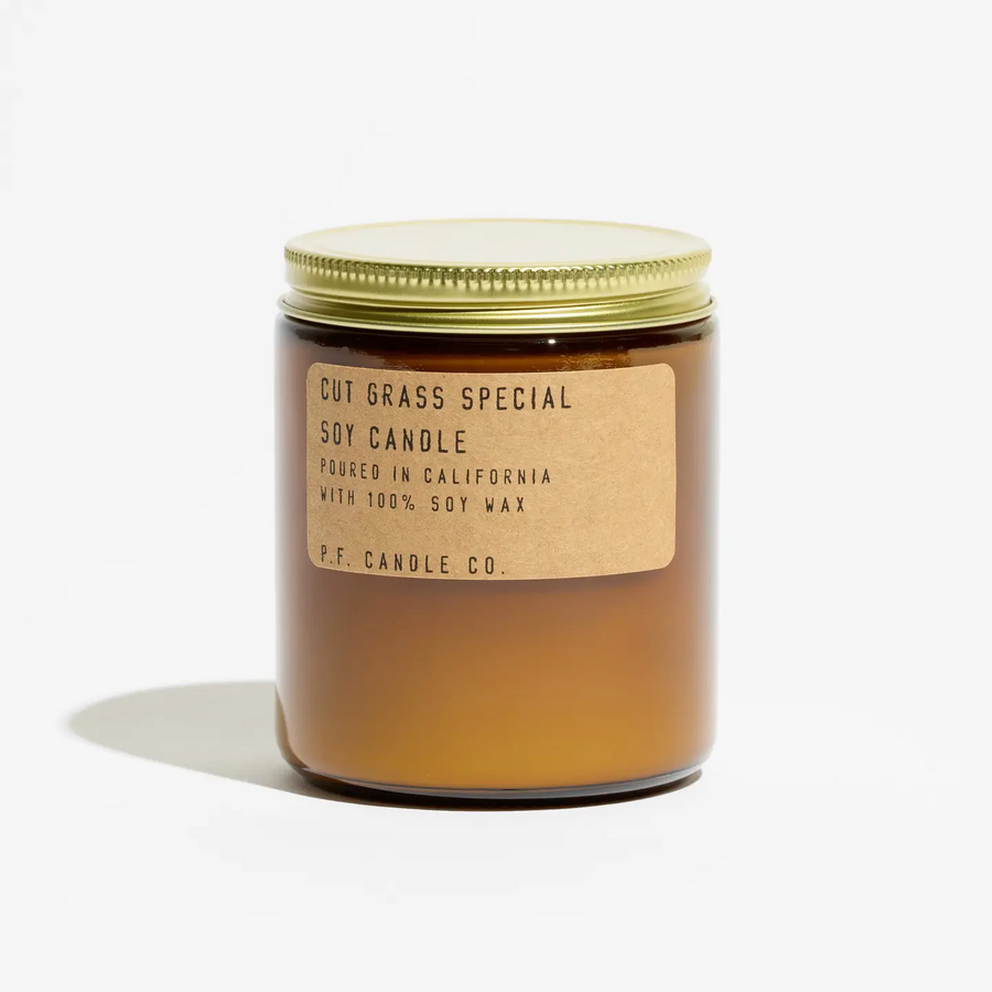 Soy candle with a gold lid and label on a white background. Available at Luca Essentials in Los Angeles. 