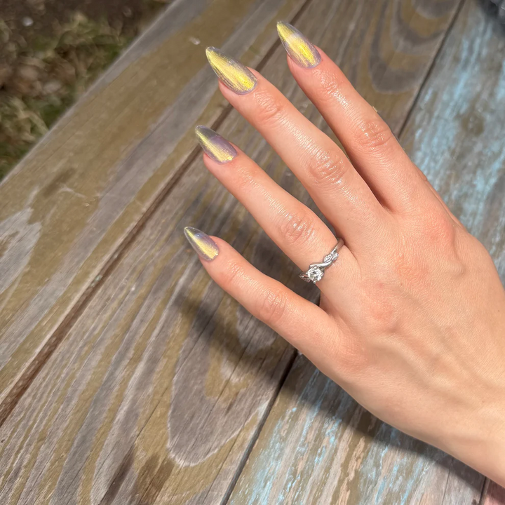 Hand with yellow and gray nail polish on a wooden surface

Sun yellow-gold metallic shimmer with blueish tint. Ethereal, reflective and foil-like.

Available at Luca Essentials in Los Angeles. 