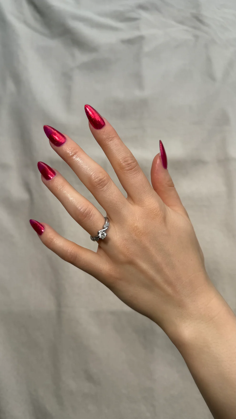 Hand with red nail polish wearing a silver ring on a neutral background

High-impact molten garnet metallic red. Easy coverage and build-up, this dense micro-shimmer gives a foil-like reflective red glow.

Available at Luca Essentials in Los Angeles. 