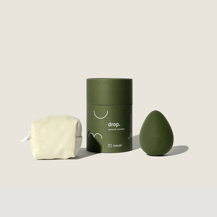Green electronic device shaped like an egg with a green cylindrical container and a white canvas bag with zipper. 

Drop's shape rests easily in your palm for versatile all-over stimulation. Intended as an all-body, erogenous zone body massager—mimicking the ball of a wand without the handle.

Available at Luca Essentials in Los Angeles. 
