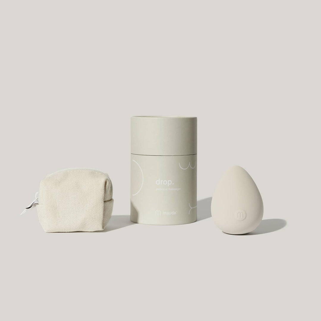 Grey electronic device shaped like an egg with a green cylindrical container and a white canvas bag with zipper. 

Drop's shape rests easily in your palm for versatile all-over stimulation. Intended as an all-body, erogenous zone body massager—mimicking the ball of a wand without the handle.

Available at Luca Essentials in Los Angeles. 