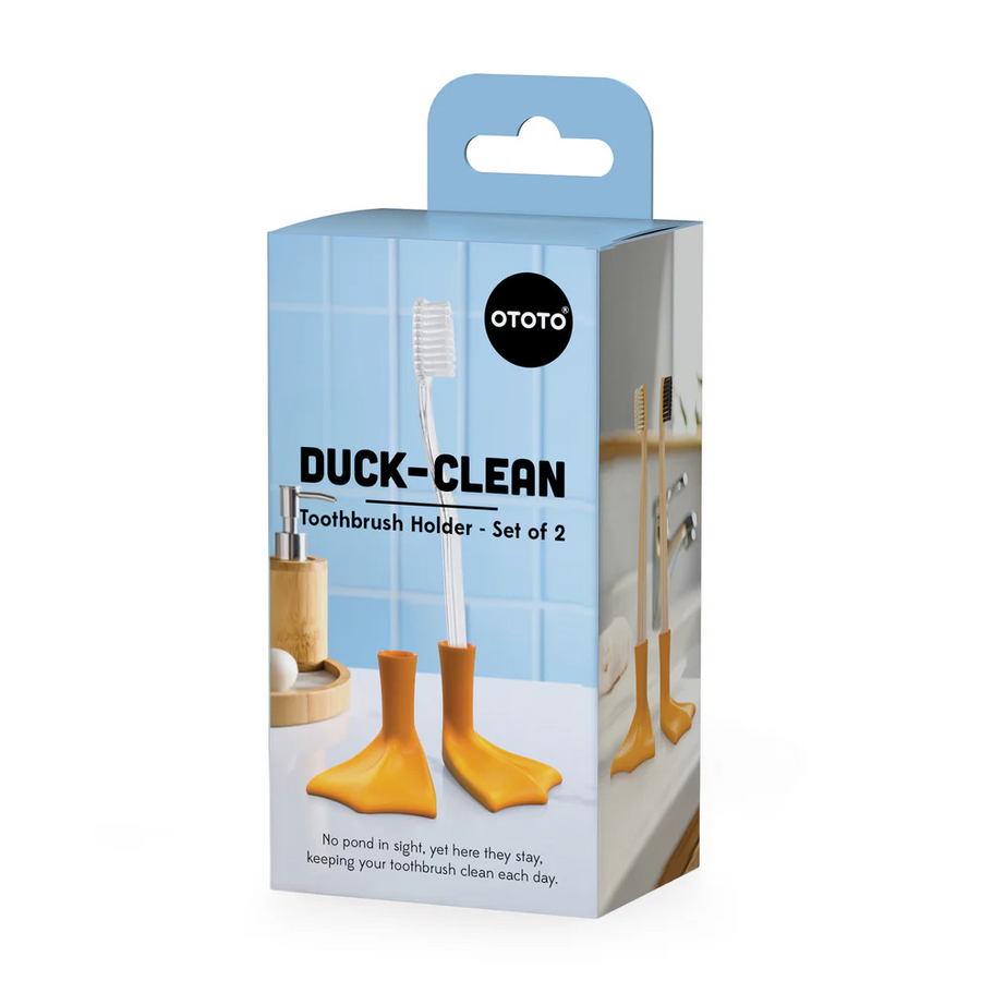 Package of Ototo Duck-Clean Toothbrush Holder with a toothbrush on a white background. Available at Luca Essentials in Los Angeles. 