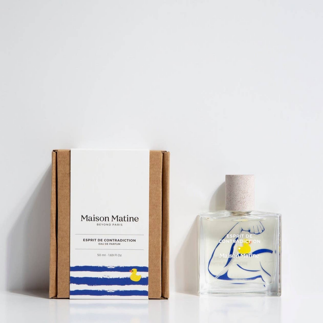 Glass bottle of Maison Matine perfume with an illustration of a flexed arm and a rubber duck sitting on the bicep on a white background. 

Maison Matine perfumes each have their own refreshing scent. The unisex, fresh, unique fragrances are created by eclectic, talented, creative perfumers.

Available at Luca Essentials in Los Angeles. 