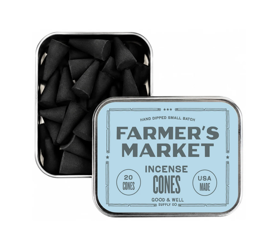Incense cones in a tin labeled 'Farmer's Market' on a white background. Available at Luca Essentials in Los Angeles. 