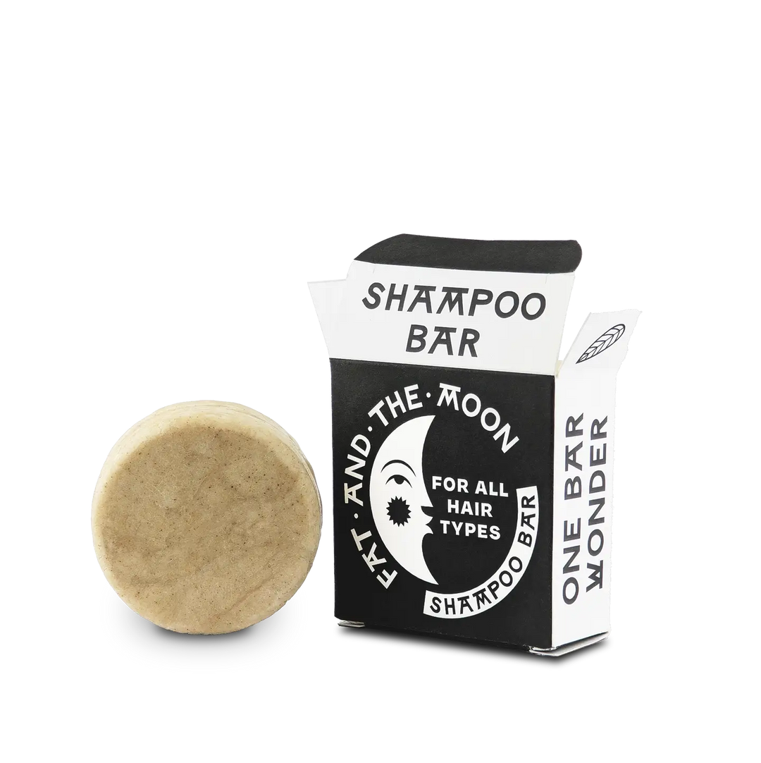 Shampoo bar with packaging labeled 'Fat  and The Moon' on a white background. Available at Luca Essentials in Los Angeles.
