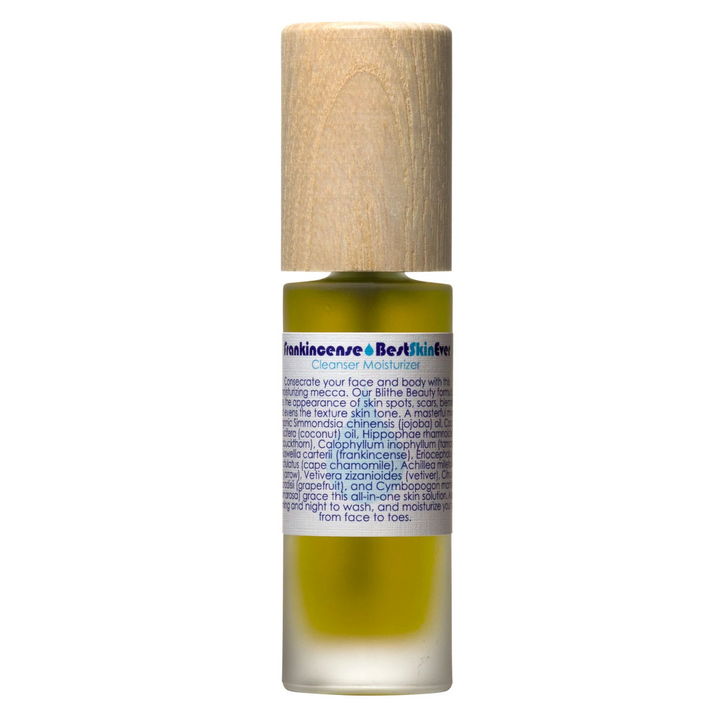 a glass bottle with green liquid and the title 'Frankincense Best Skin Ever Cleanser Moisturizer' with a wooden lid on a white background. Available at Luca Essentials in Los Angeles. 
