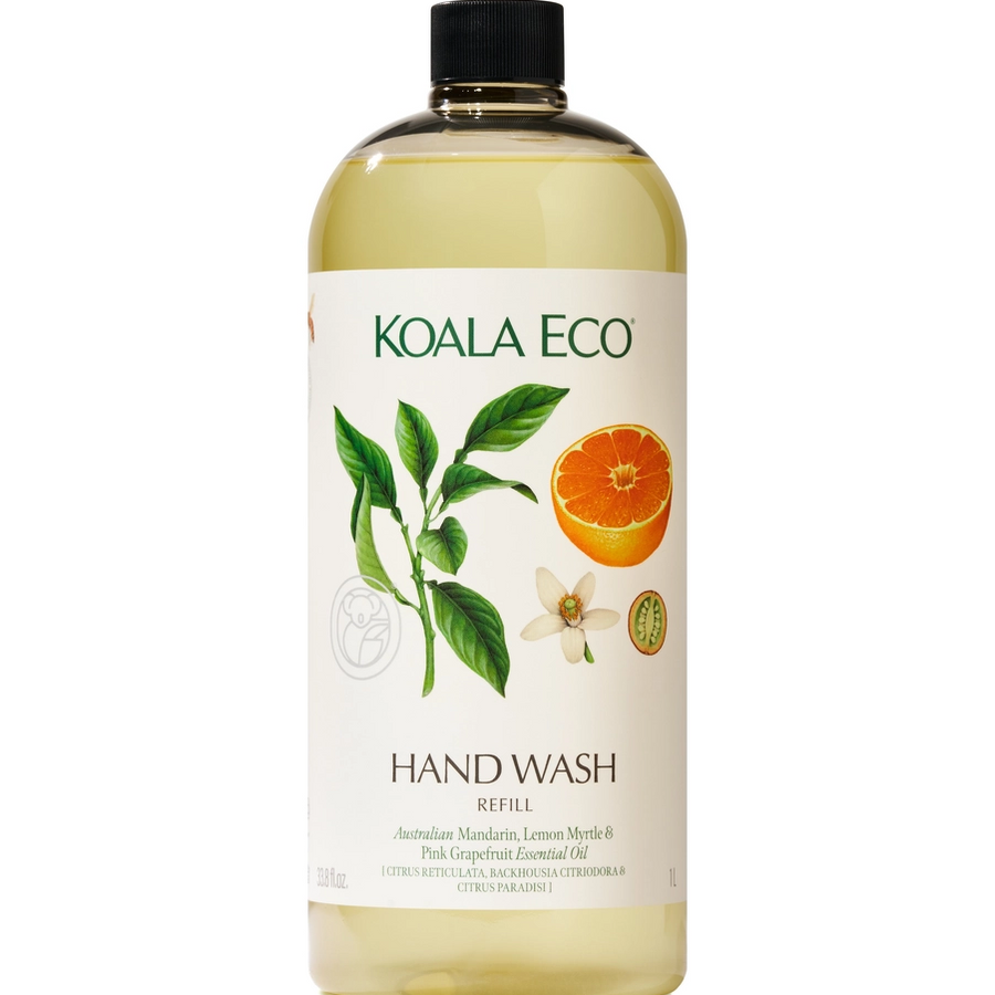 A bottle of KOALA ECO Hand Wash Refill with a black cap, featuring a white label with green text and illustrations of a lemon myrtle leaf, orange slice, and flower, set against a plain white background. Available at Luca Essentials in Los Angeles. 