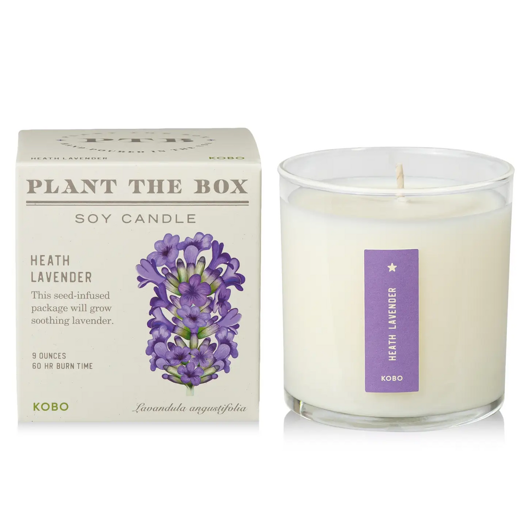 glass candle with the words 'heath lavender' on it, next to a box with the title 'plant the box' on it. Available at Luca Essentials in Los Angeles. 