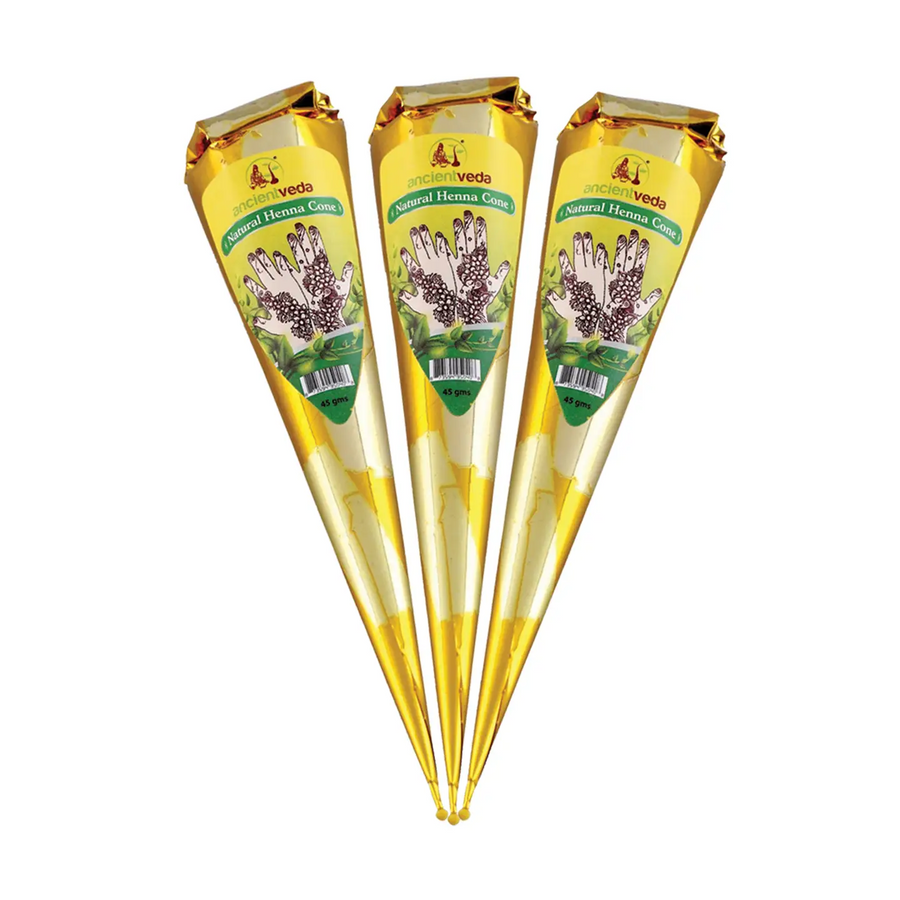 Three wrapped cone-shaped products arranged side by side on a plain white background. Each cone is wrapped in shiny gold foil with a printed label that reads 'Natural Henna Cones' with an illustration of hands covered in floral henna designs. Available at Luca Essentials in Los Angeles
