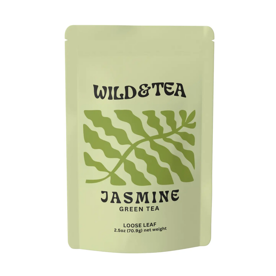 Green tea package with 'Wild & Tea' branding and a light green leaf illustration on a white background. Available at Luca Essentials in Los Angeles. 