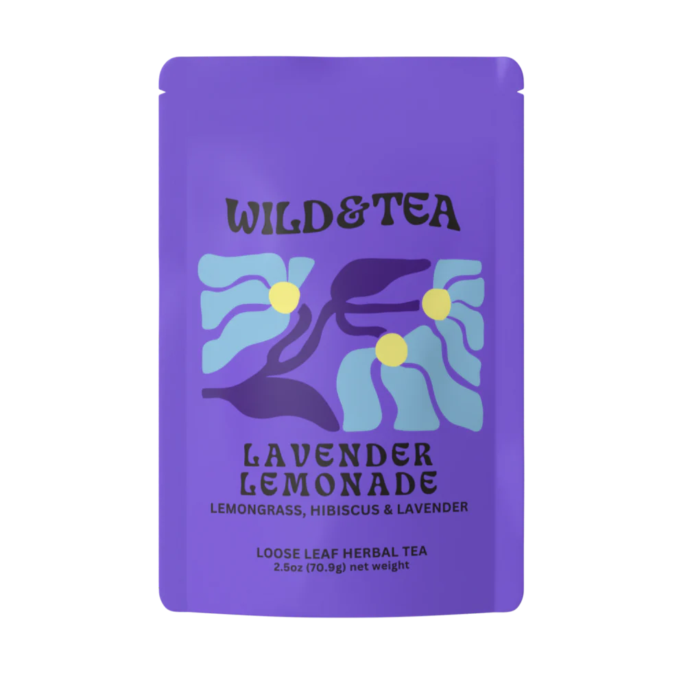 A purple stand-up pouch of Wild & Tea Lavender Lemonade loose leaf herbal tea, featuring a stylized graphic of lavender flowers in light blue, purple, and yellow on a white background. Available at Luca Essentials in Los Angeles. 