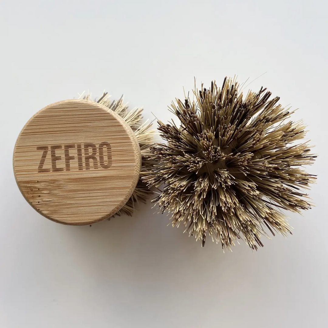 Bamboo brush with bristle head and wooden handle labeled 'Zefiro' on a white background. Available at Luca Essentials in Los Angeles. 