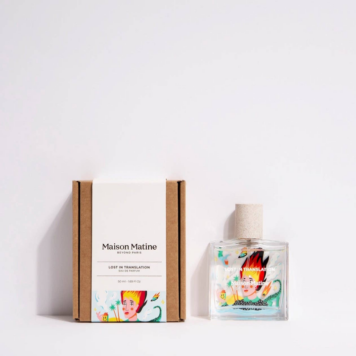 Glass bottle of Maison Matine perfume with an illustration of a woman with flames on her head on a white background. 

Maison Matine perfumes each have their own refreshing scent. The unisex, fresh, unique fragrances are created by eclectic, talented, creative perfumers.

Available at Luca Essentials in Los Angeles. 