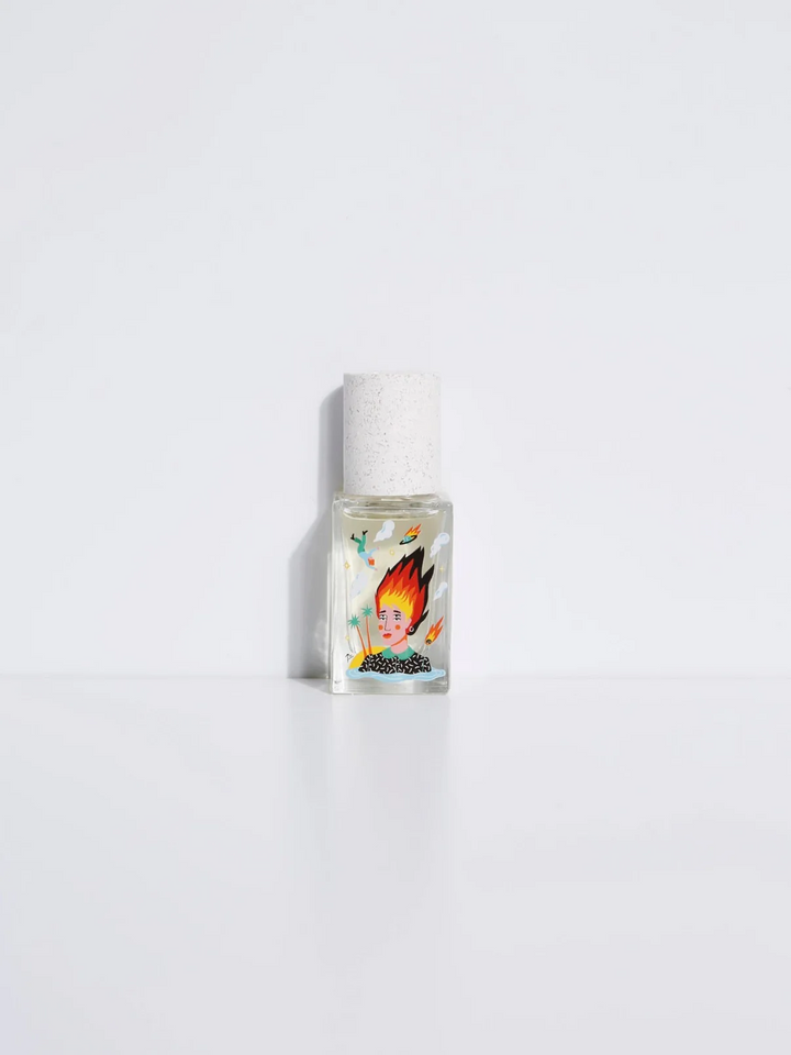 A small, clear bottle of Maison Matine perfume with a white label depicting a woman with flames on her head and cap, presented against a white background.

Maison Matine perfumes each have their own refreshing scent. The unisex, fresh, unique fragrances are created by eclectic, talented, creative perfumers.

Available at Luca Essentials in Los Angeles. 