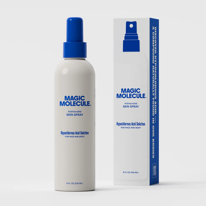 Magic Molecule skin spray bottle with a blue spray top and blue writing and the size 8oz and packaging on a white background. Available at Luca Essentials in Los Angeles. 