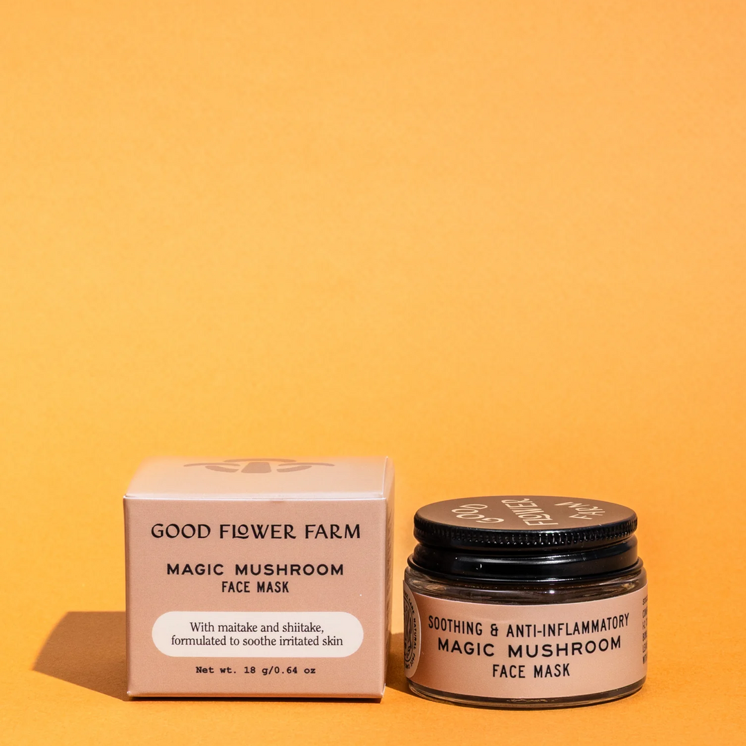 Good Flower Farm magic mushroom face mask jar and box on an orange background. Available at Luca Essentials in Los Angeles. 