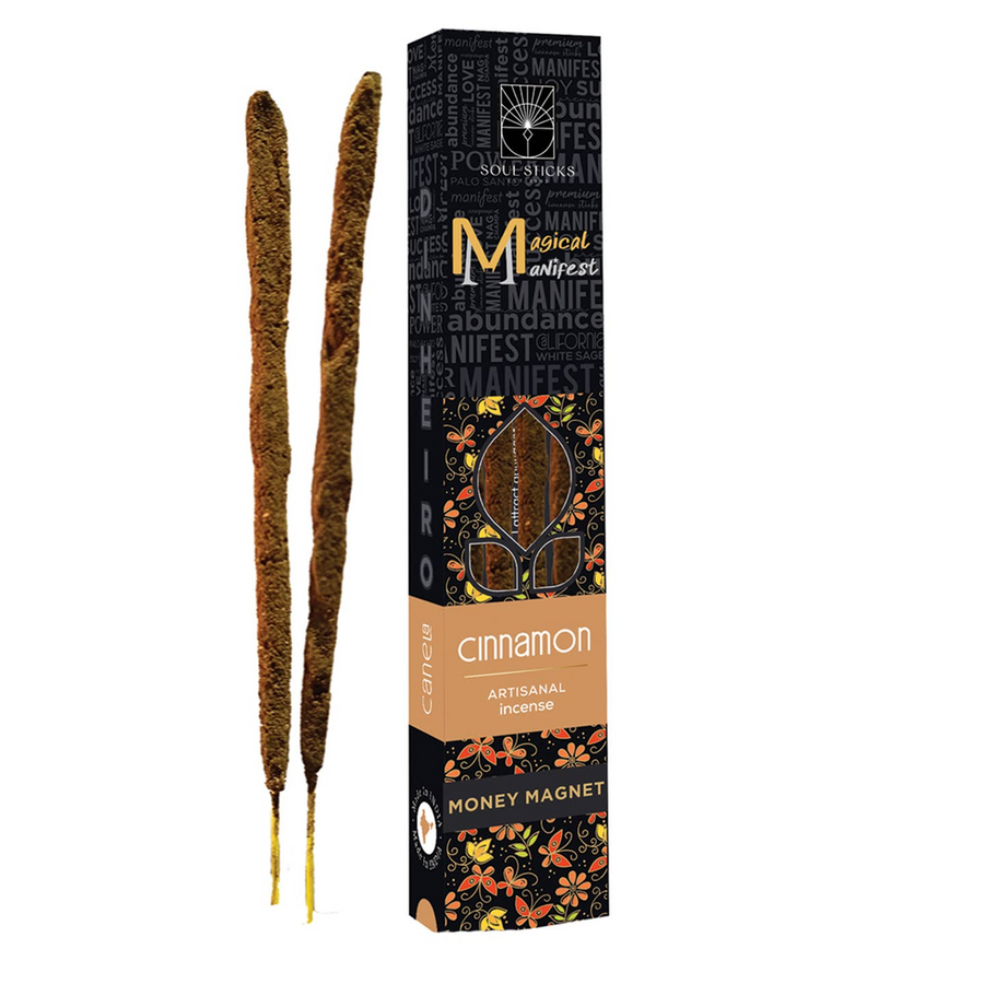 A box of Magical Manifest incense with cinnamon scent, featuring two handcrafted incense sticks outside the box. Available at Luca Essentials in Los Angeles. 
