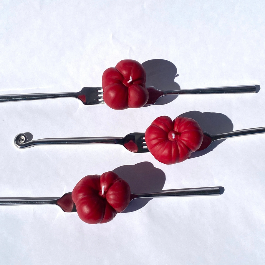 three red tomato shaped candles on three forks on a white background.

Small but packed with personality. Our Mini Tomato Candle is a juicy little nod to peak farmer’s market season. Hand-poured in rich tomato red, it’s the tiniest member of our tomato family.

Available at Luca Essentials in Los Angeles. 