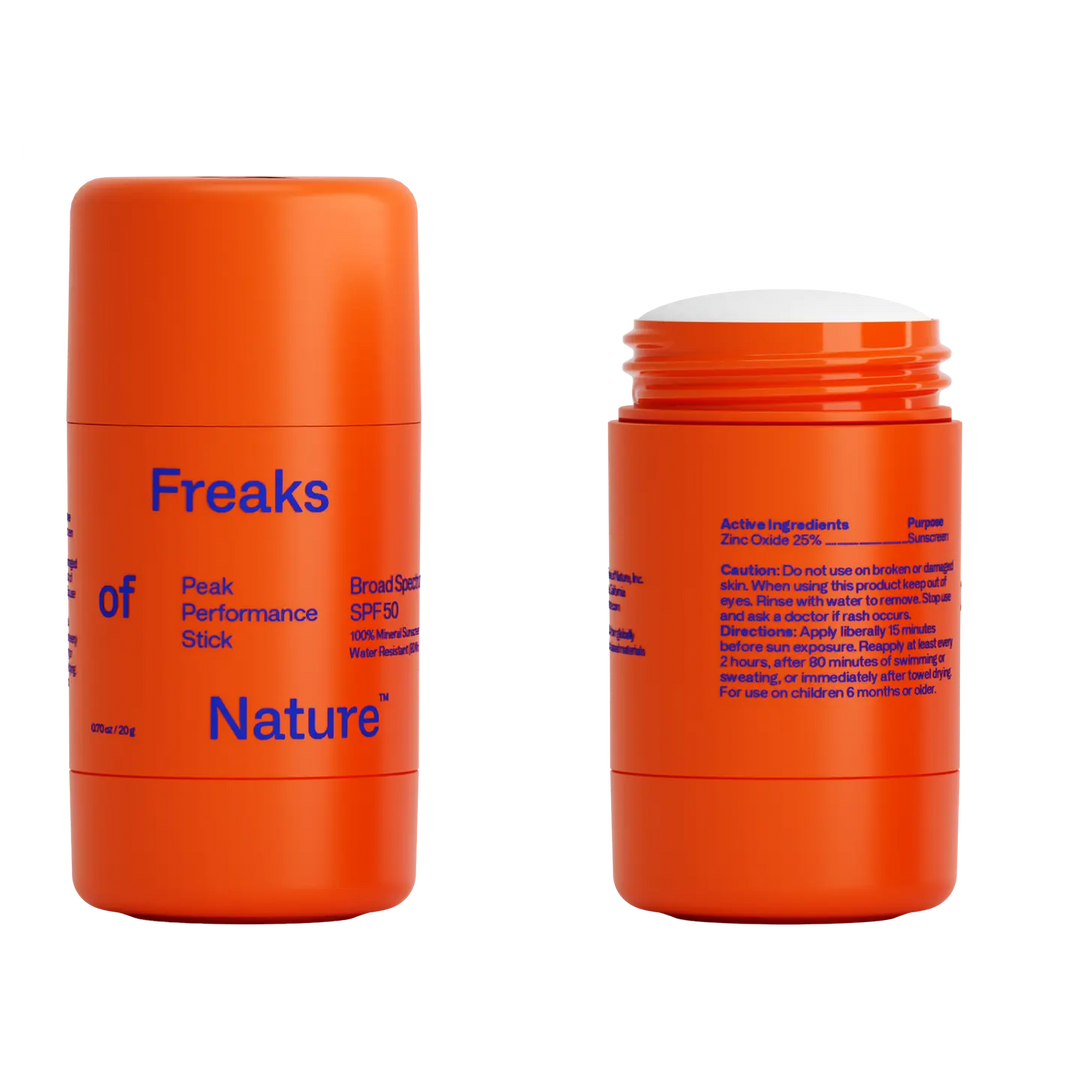 Two orange sunscreen sticks with blue text on a white background. Available at Luca Essentials in Los Angeles. 