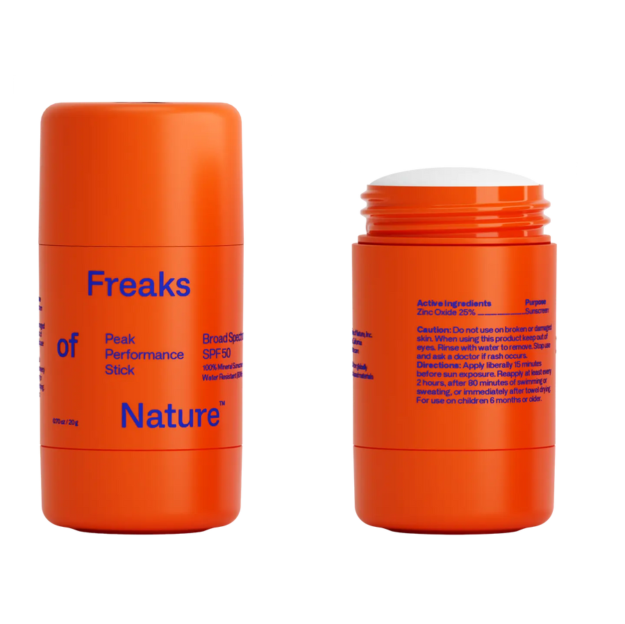Two orange sunscreen sticks with blue text on a white background. Available at Luca Essentials in Los Angeles. 