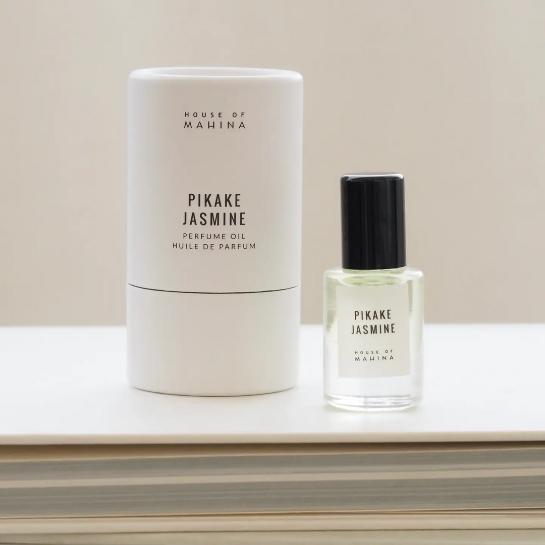 House of Mahina Pikake Jasmine perfume oil bottle and packaging on a light surface with a neutral background. Available at Luca Essentials in Los Angeles. 