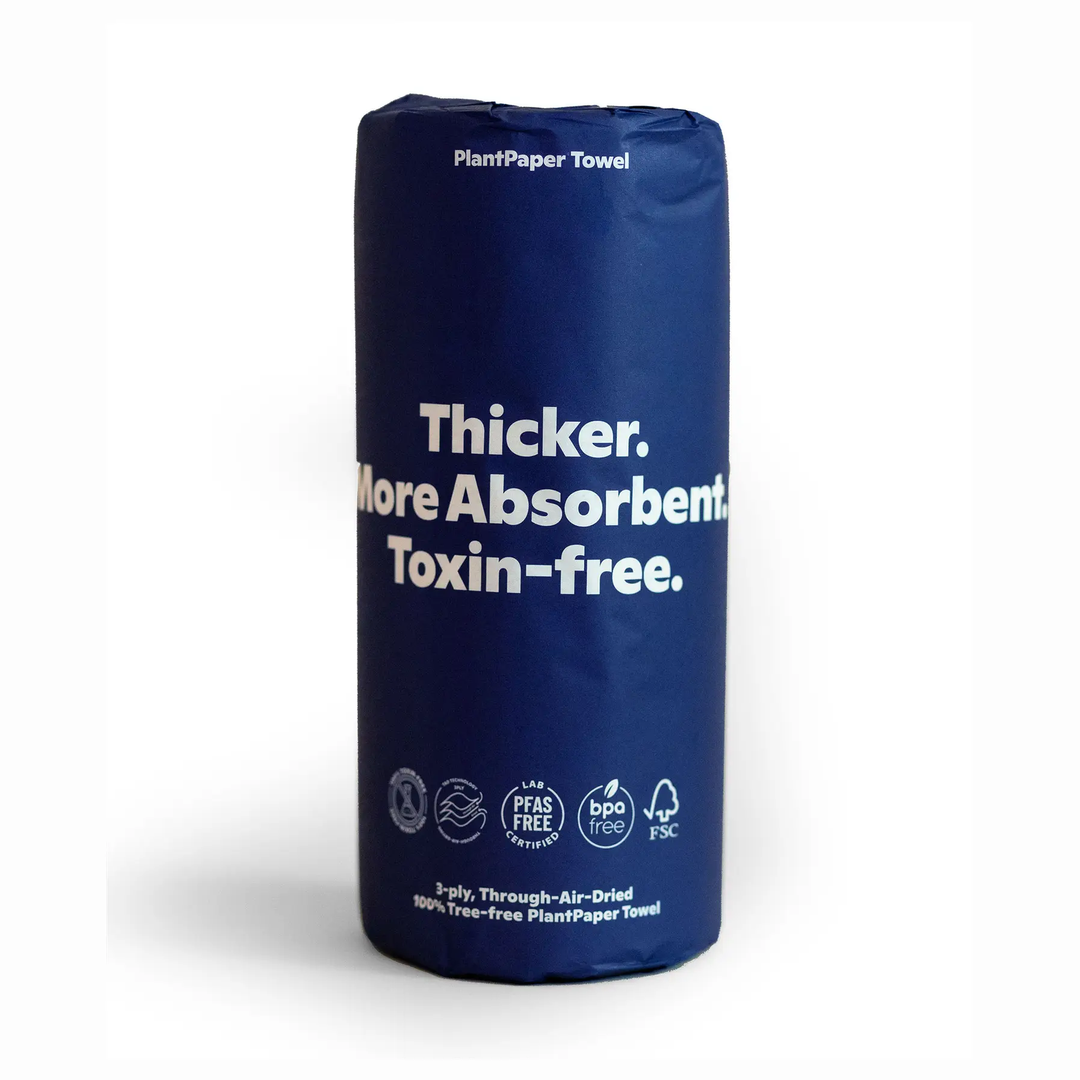 A single roll of PlantPaper Towels in a dark blue cylindrical sleeve with white text, shown on a clean white background. Available at Luca Essentials in Los Angeles. 